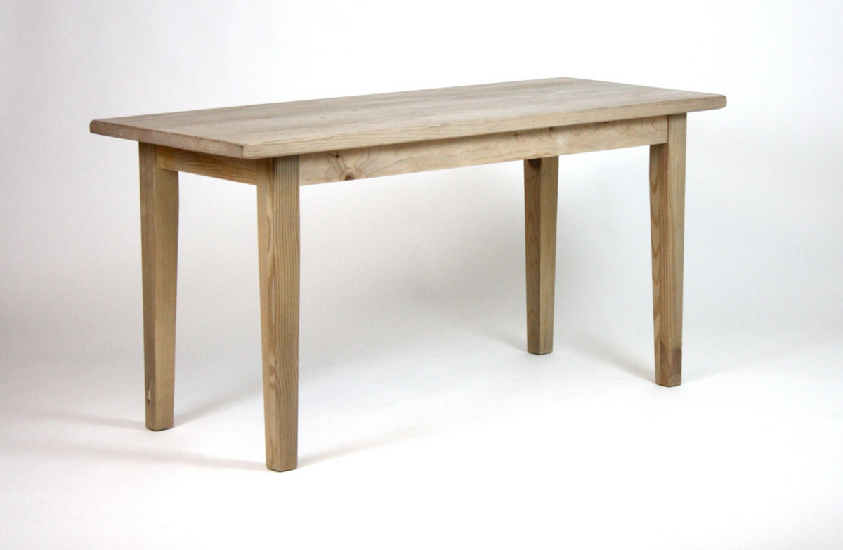 A rectangular wooden table unfinished, featuring four legs and a simple design, photographed against a white studio background.