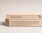 Two stacked unfinished wood blocks with engraved text on a light beige background. The top block reads 'Ready-for-Finish' and the bottom block contains descriptive text about reclaimed wood.