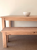Coastal dining table and matching bench set handcrafted from solid wood